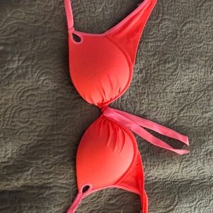 A large pink Victoria secret swim top